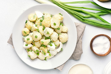 Potato salad with eggs and green onion