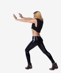 Fototapeta premium back view of woman pushes wall