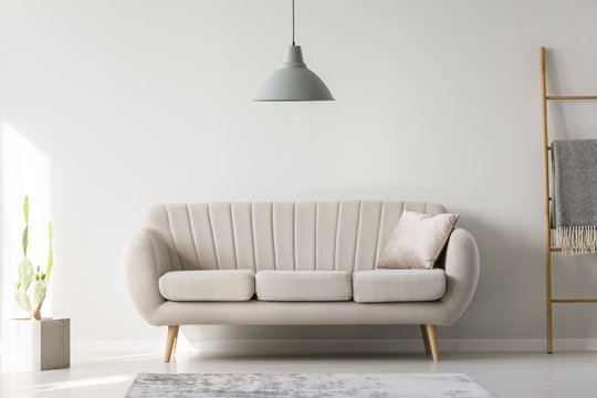 Lamp hanging above couch