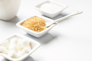 Different types of sugars in the white bowls