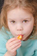 baby girl vegetarian with mandarin slice