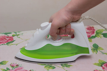 Closeup ironing clothes on ironing board