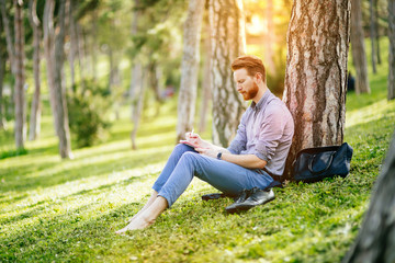 College student studying in park