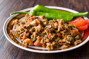 Turkish Street Food Kokorec with Tomato and Green Pepper. (Portion Sheep Bowel)