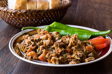 Turkish Street Food Kokorec with Tomato and Green Pepper. (Portion Sheep Bowel)