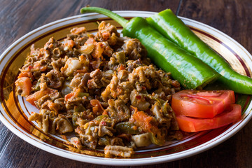Turkish Street Food Kokorec with Tomato and Green Pepper. (Portion Sheep Bowel)