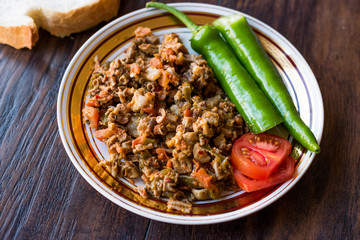 Turkish Street Food Kokorec with Tomato and Green Pepper. (Portion Sheep Bowel)