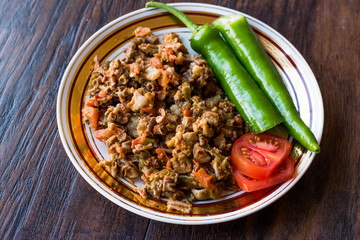 Turkish Street Food Kokorec with Tomato and Green Pepper. (Portion Sheep Bowel)