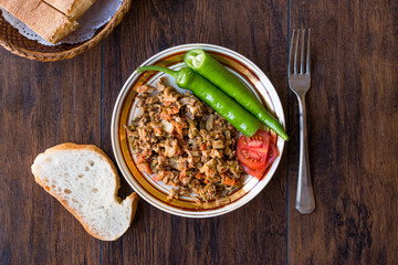 Turkish Street Food Kokorec with Tomato and Green Pepper. (Portion Sheep Bowel)