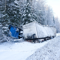 Moscow region, Russia - February, 2, 2018: the truck turned over in a ditch on a snow-covered road in Moscow region, Russia
