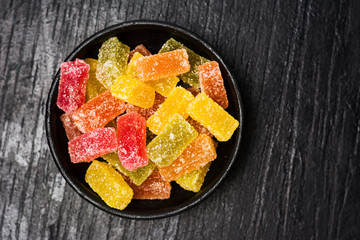 Jelly candy pieces in dark bowl