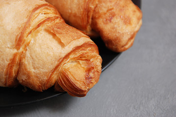 Croissant Homebaked Isolated on a Gray Background Closeup. Breakfast Food Concept.