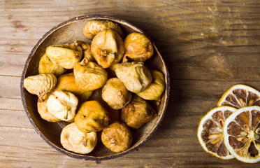 Dry figs in a rustic bowl tabletop shot