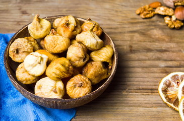 Dry figs in a rustic bowl tabletop shot