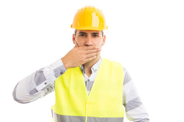 Constructor or builder covering his mouth.
