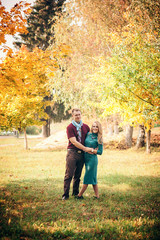 Obraz premium Beautiful young couple walking in autumn park
