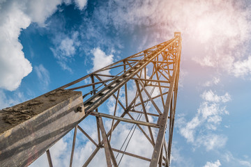 pile driver with clouds and blue sky