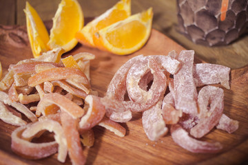 candied tropic fruits on wooden table 