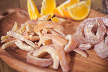 candied tropic fruits on wooden table 