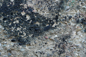 Old grunge cement with pebbles