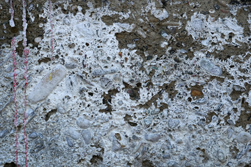 Old grunge cement with pebbles