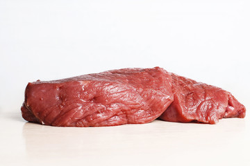 Fresh raw juicy  beef on a white background