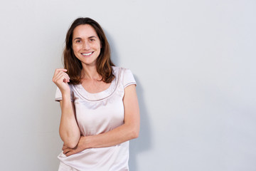 Obraz premium happy older woman standing against white background