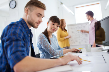 Fototapeta premium creative team with blueprint at office