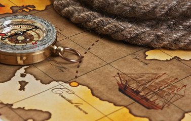 compass and rope on map