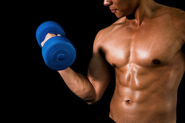 Fototapeta na wymiar muscular sporty guy lifting weights