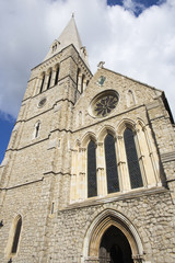 Fototapeta na wymiar London - The tower and facade of church St. Barnabas,