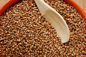 buckwheat groats in a bowl on a wooden table