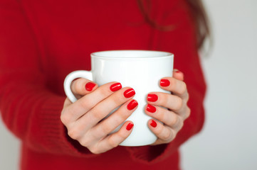 cup of hot coffee in the hands.