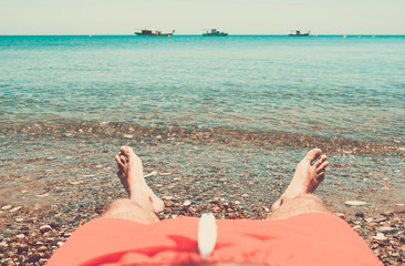 Man relaxing on the beach