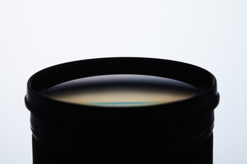 close-up shot of camera lens silhouette on white