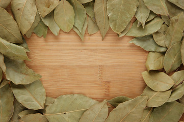 frame of dried Bay leaf, a wooden Board
