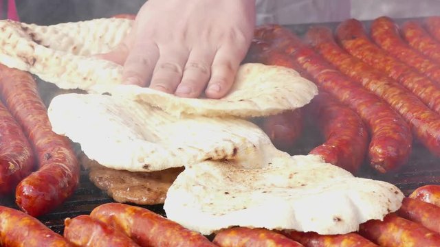 Pork sausages and meat on grill, 4k Video Clip