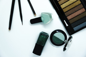 Make up brush and cosmetics isolated on white background.