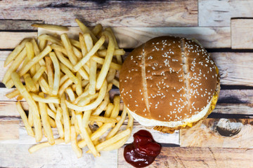 Obraz na płótnie Canvas Cheese burger - American cheese chicken burger with fresh salad
