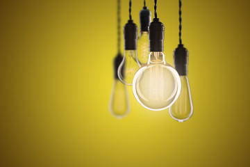 Vintage bulbs on color background - idea, innovation, teamwork and leadership concept. Space for text