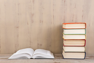 Education and reading concept - group of colorful books on the wooden table