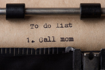 Call mom - text message on the typewriter close-up