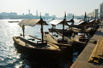 Fototapeta na wymiar Traditional Abra ferries at the creek in Dubai, United Arab Emirates