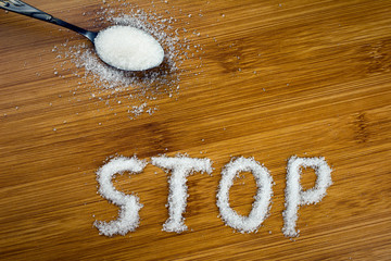 sugar inscription stop on the table, spoonful of sugar. concept No Sugar Diet. can be used as a...