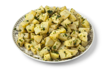 Moroccan dish with potato salad and herbs