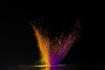 orange and purple holi powder explosion on black, Hindu spring festival