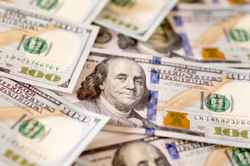 American dollars. A stack of hundred dollar bills. Close up of new hundred dollar bill