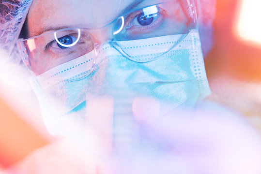 Medical science researcher performing test in laboratory