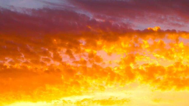 Beautiful yellow and orange cloudscape time lapse footage of sunset
