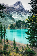 Beautiful turquoise lake in the mountains. Beauty of nature. Walking tour through the nature...